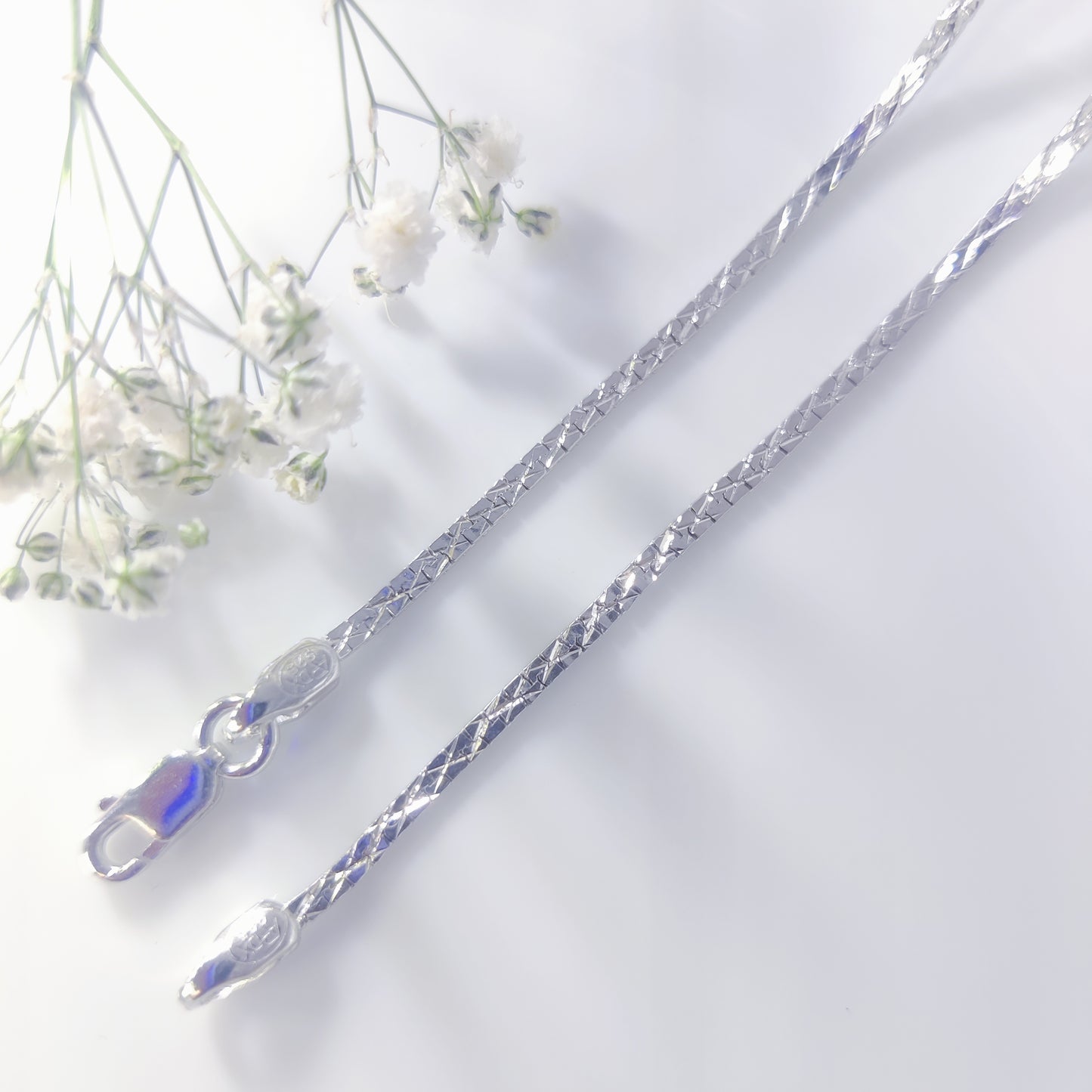 Radiant Twist Silver Chain